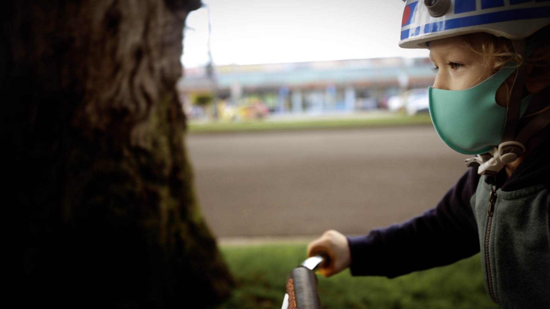 a close-up of a boy riding his bike