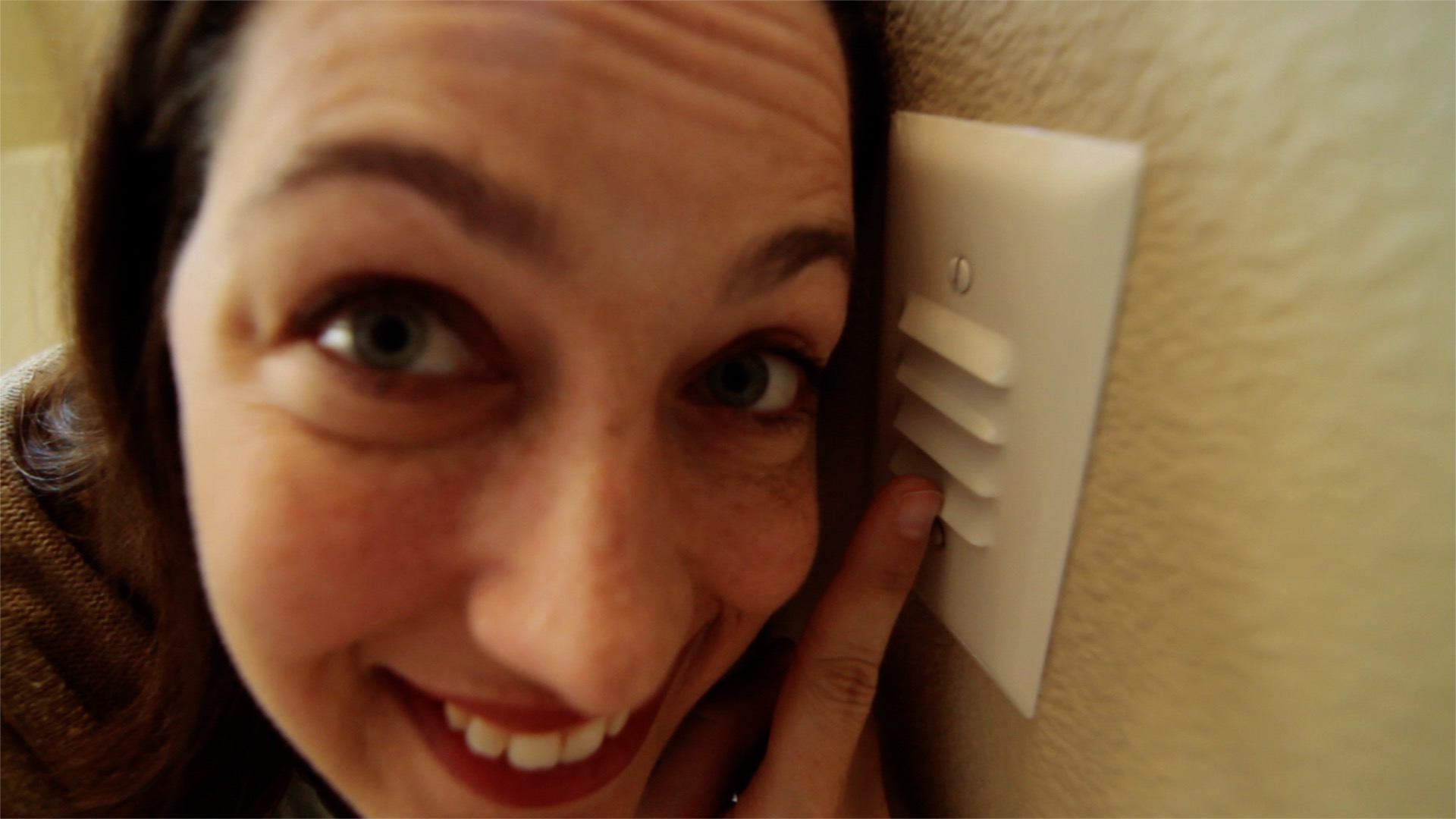 a woman pointing at stair lights